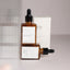 Organic rejuvenating face serum with Bakuchiol, Rosehip, and Calendula-infused Jojoba Oil displayed on a natural skincare backdrop for hydration and anti-aging